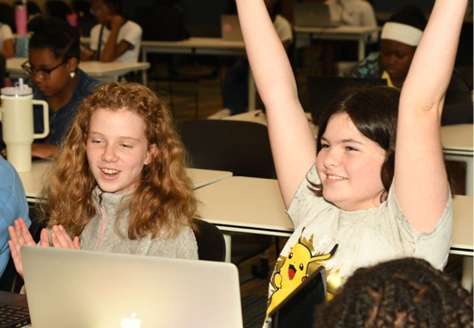 Girls Code Savannah Summer camp students celebrating a successful Foiled Pretty website launch